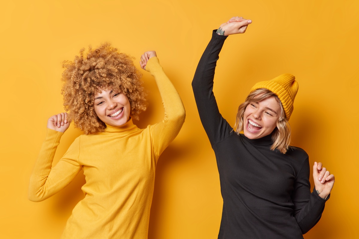 Happy employees dancing with joy